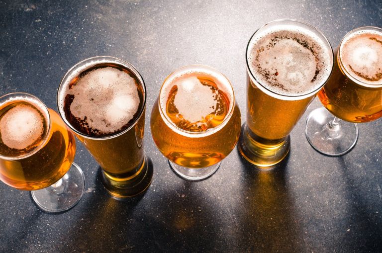 stock photo beer glasses on dark table 367622333 1920w 768x509